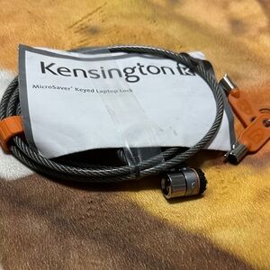 Kensington Laptop Lock with Silver Cable and Orange Accents